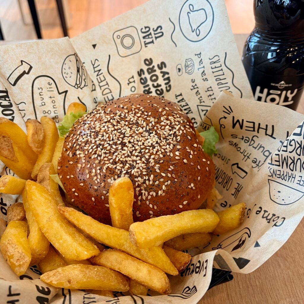 Burger meal with fries and drink at Holy Cow! in Zurich