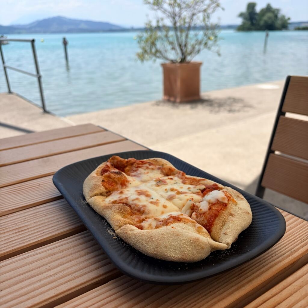 Margarita Pinsa at lakeside dinning area at Strandbad Zug Switzerland Family Guide