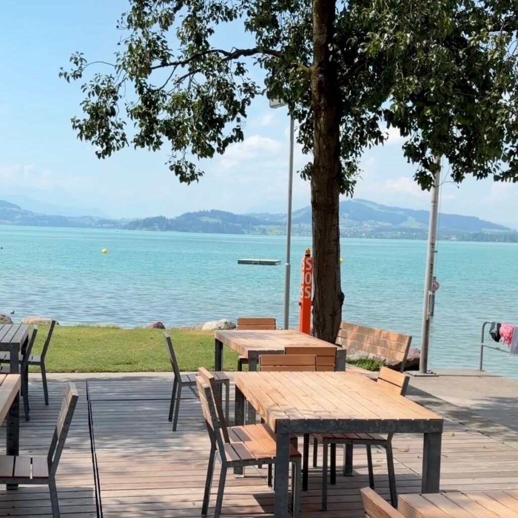 Outdoor shaded dinning area at Strandbad Zug Switzerland Family Guide