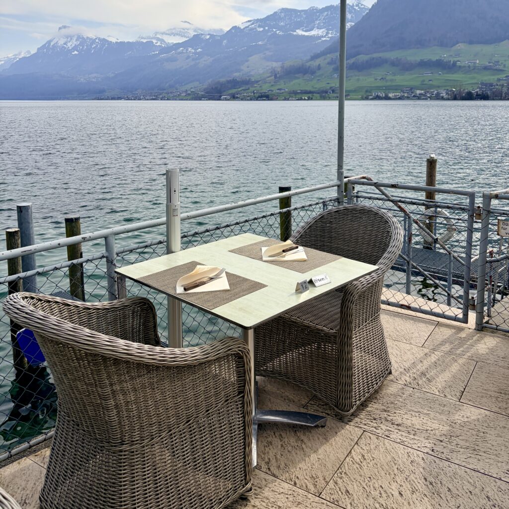 Outdoor terrace with views of Lake Lucerne and Mountains at Seerestaurant Schlüssel