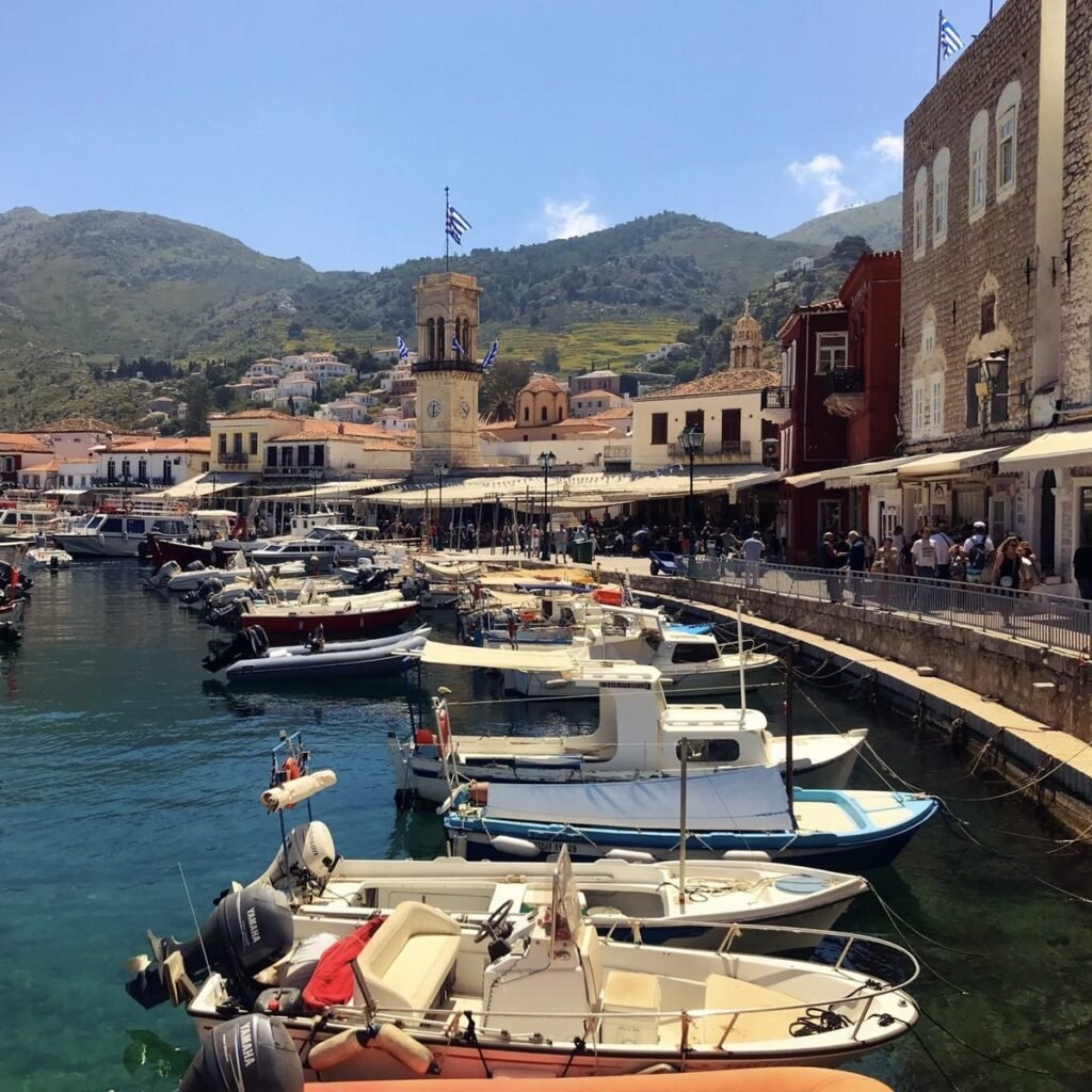 Harbor with boats and shops on Greek Island of Hydra