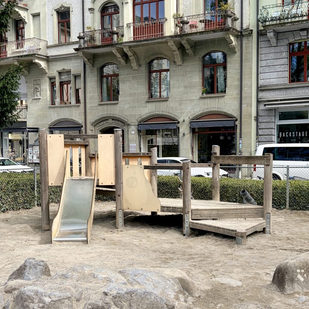Sand pit, climbing, and slide playground equipment at Spielplatz Vögeligärtli near Old Town Lucerne Switzerland