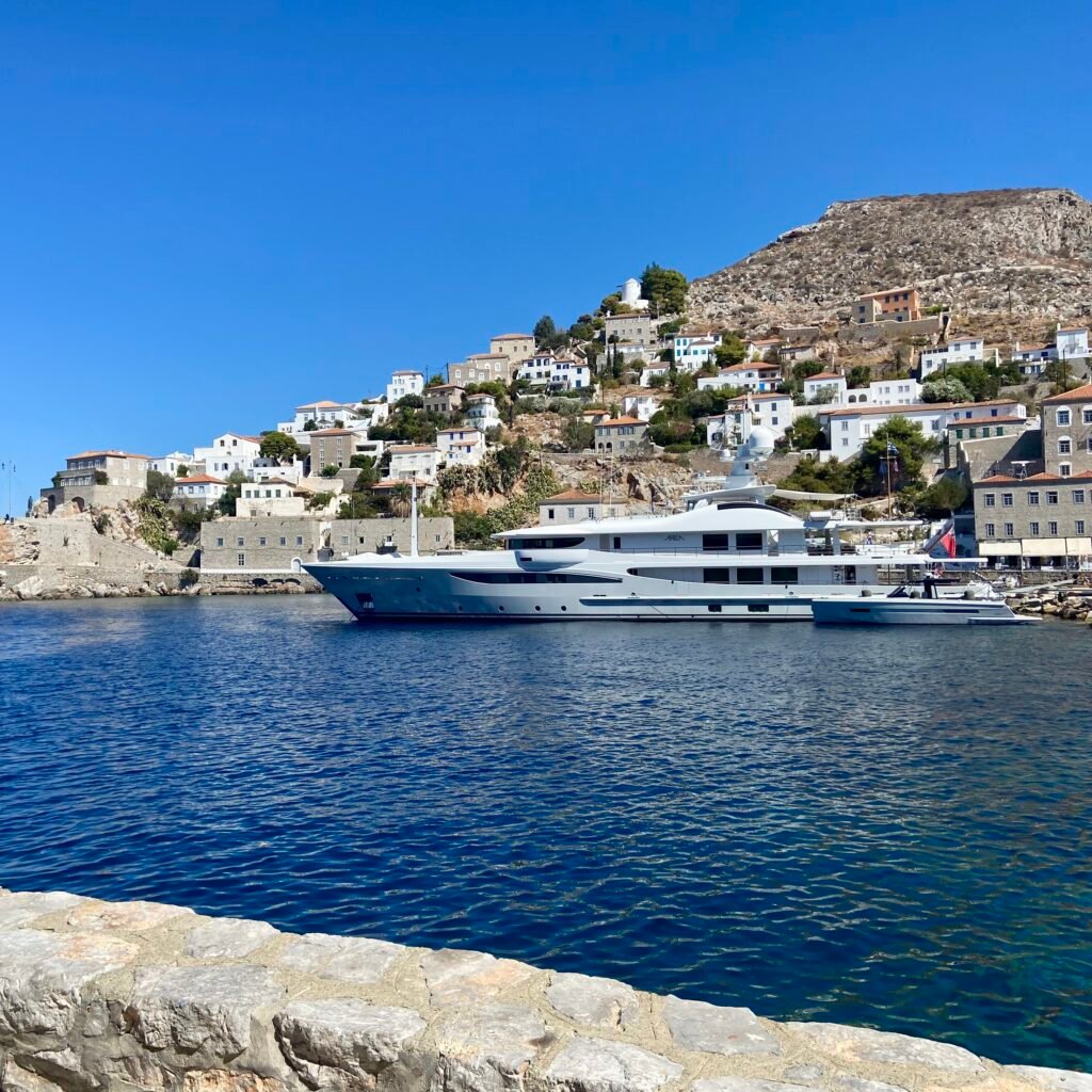 Harbor with yachts and stone buildings in the Greek Island of Hydra