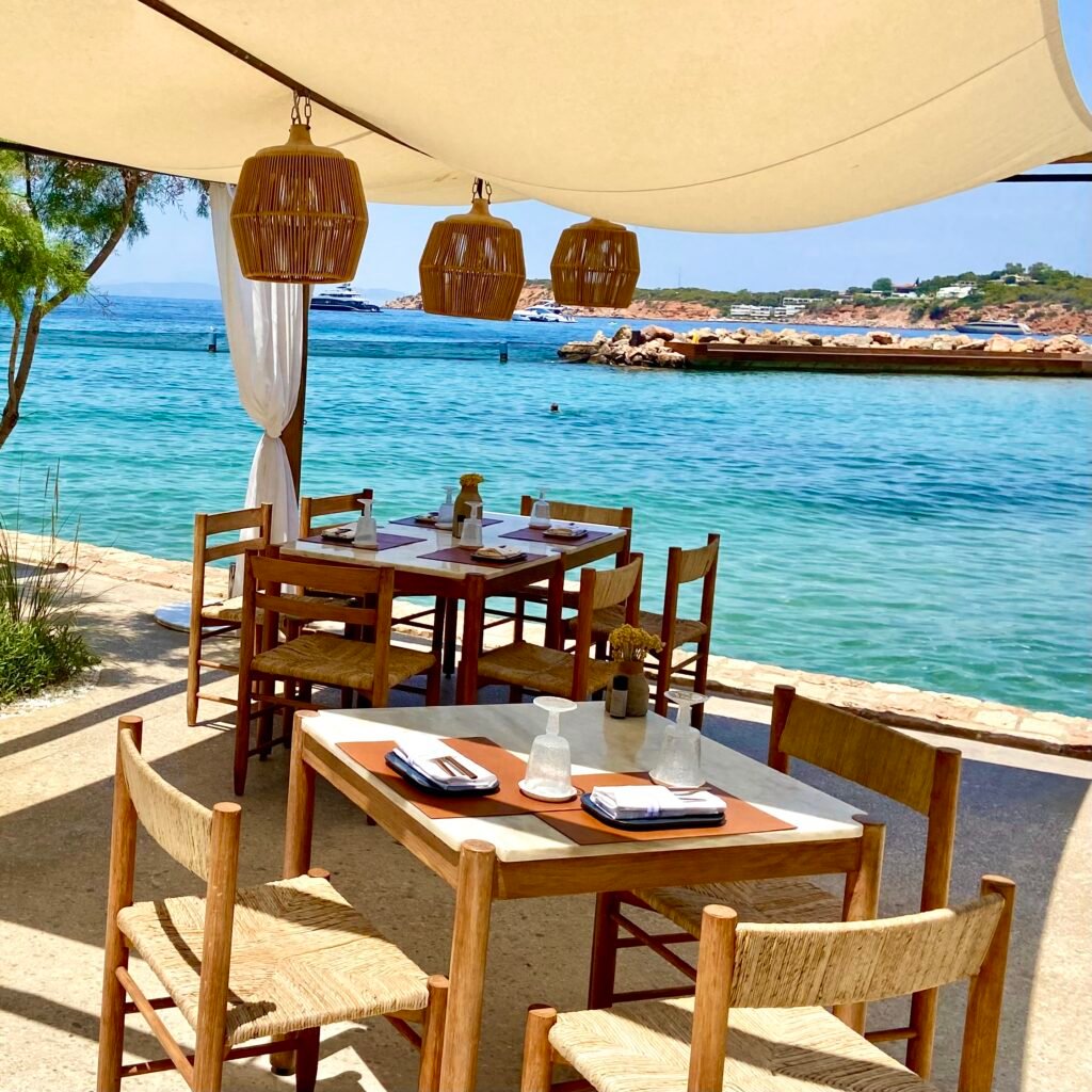 Outdoor seating Taverna 47 at Four Seasons Astir Palace Day Trips from Athens for Families