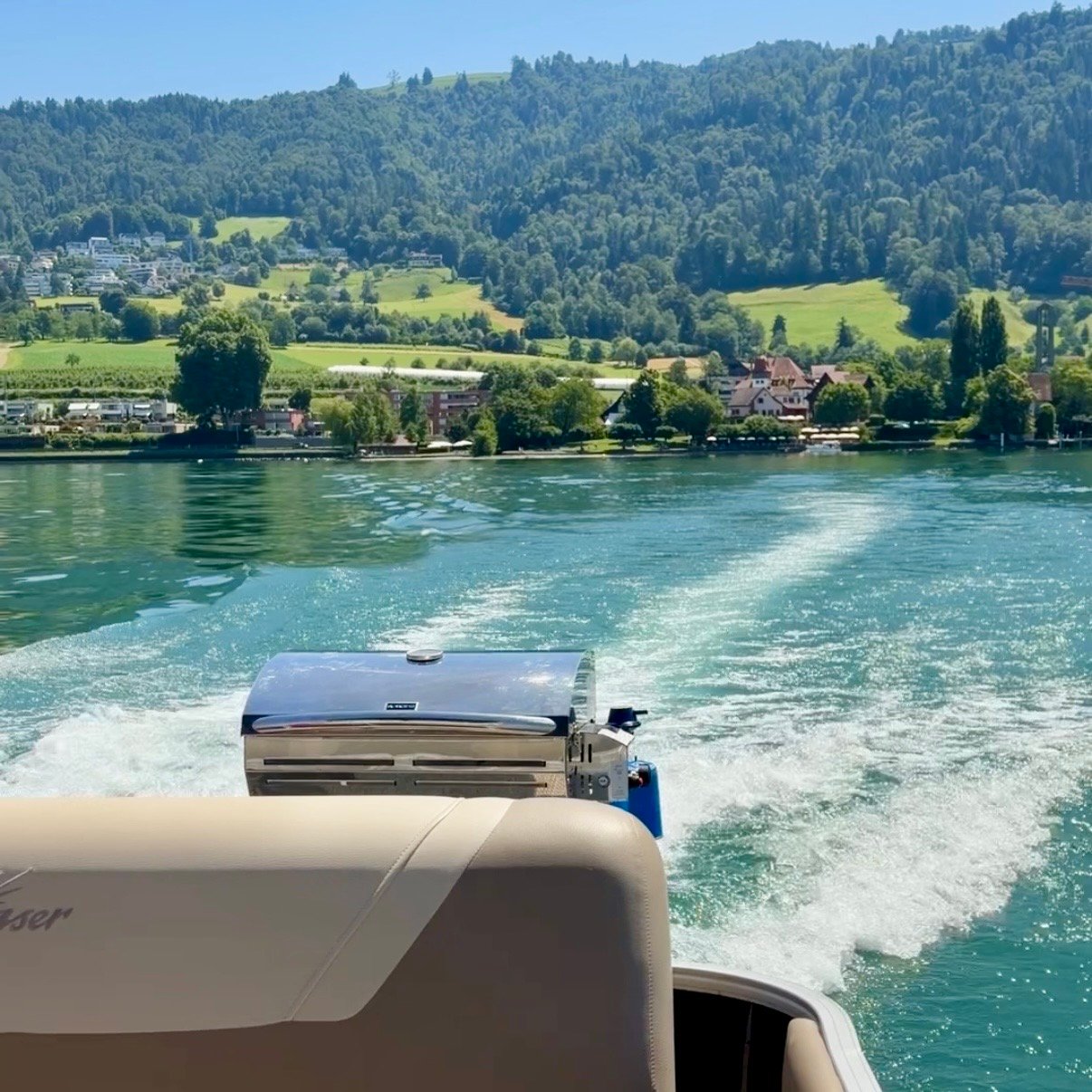 View from pontoon boat Zug Boat Rental on Lake Zug Switzerland Family Day Trip