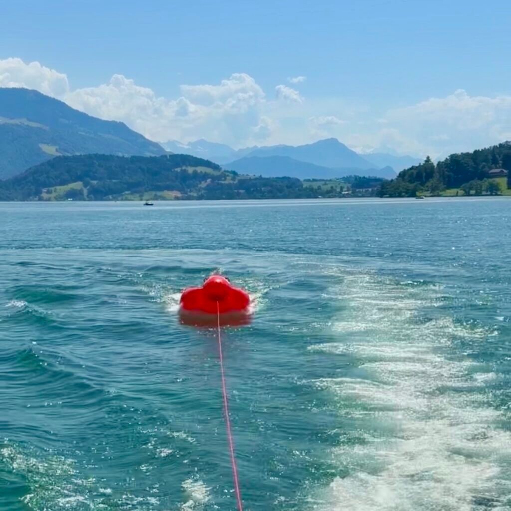 Inflatable banana tube Zug Boat Rental on Lake Zug Switzerland Family Day Trip