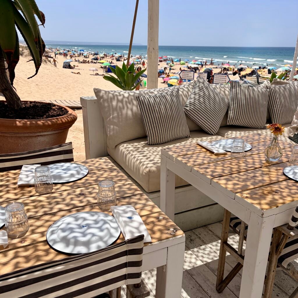 Shaded dinning table at Princesa Beach Restaurant in Praia do Rei in Costa da Caparica Kid-Friendly Beach Near Lisbon for Families