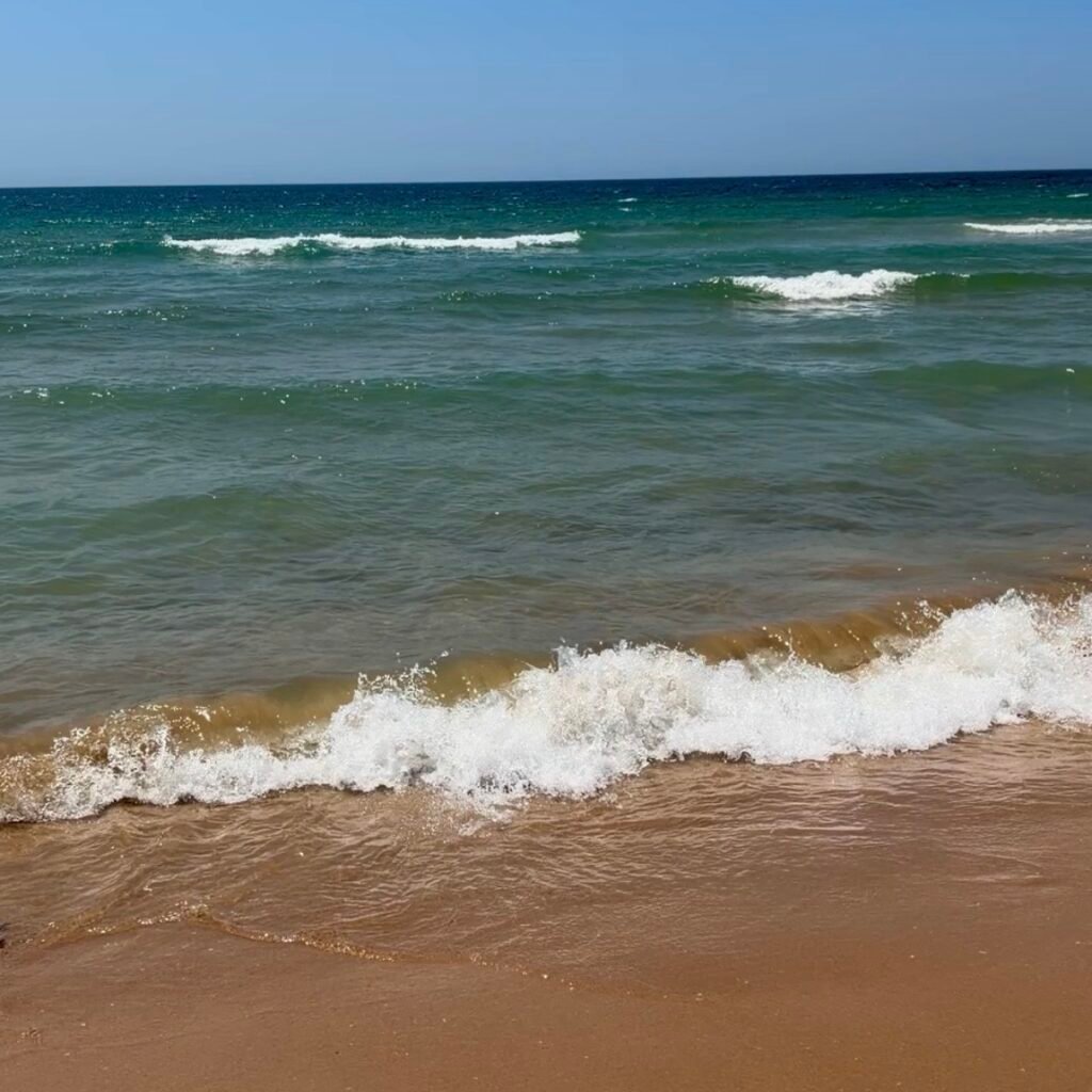 Gentle waves at Praia do Rei in Costa da Caparica Kid-Friendly Beach Near Lisbon for Families